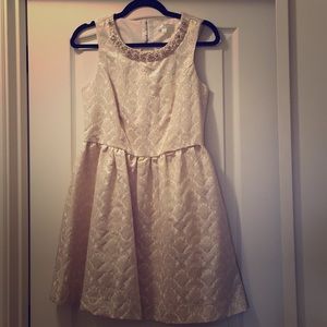 Holiday light golden dress.